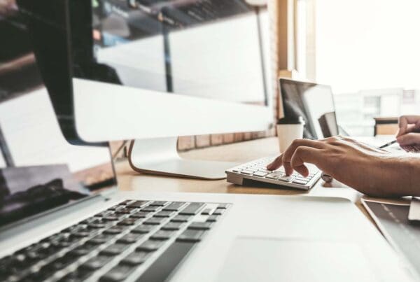 Media and Web Design Insurance - Close-up of a Web Developer Creating a Website Design and Coding Technologies in a Software Company Office